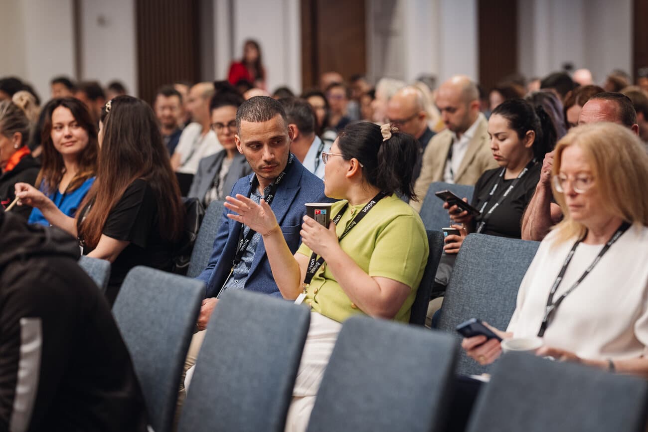 Attendees talking during the session.