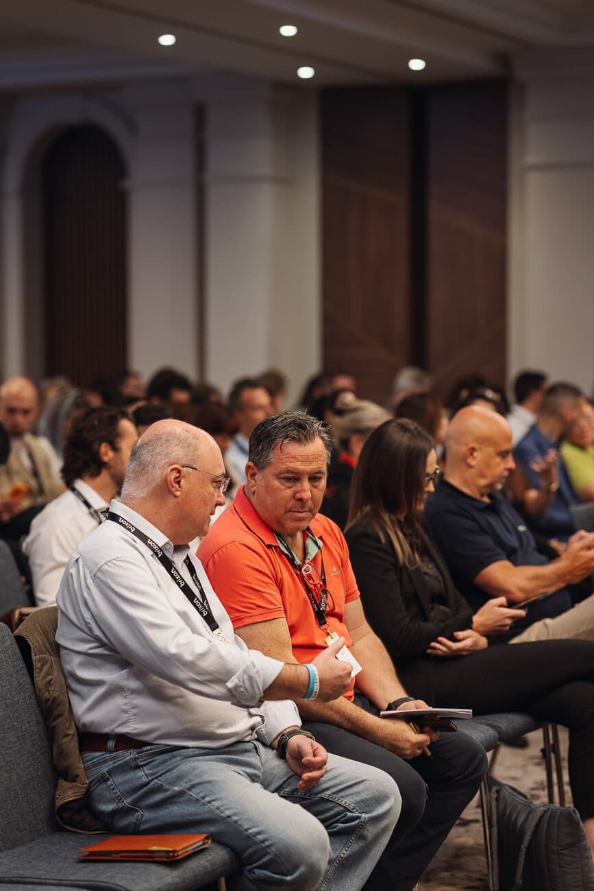 Attendees in the front row of the Brixon AI event.