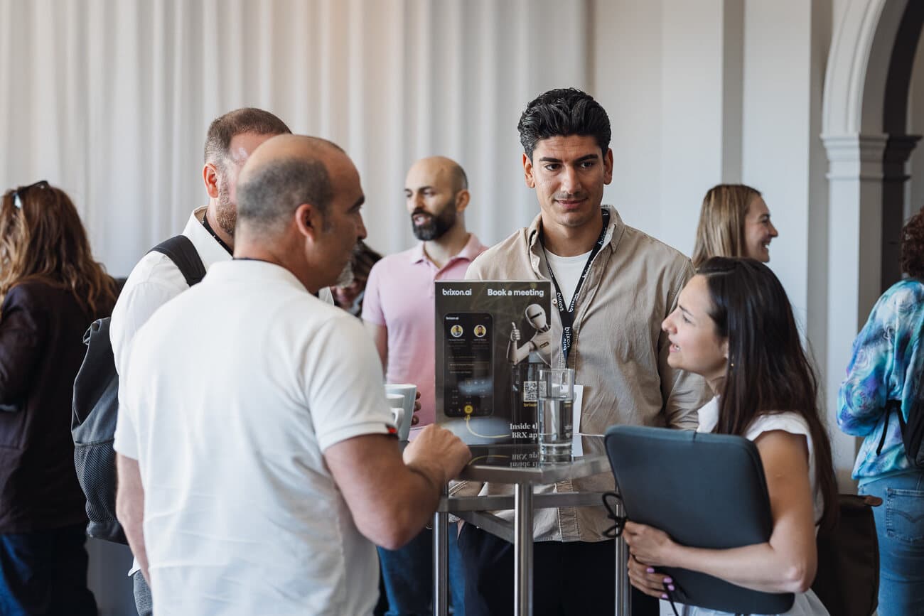 Attendees talking at the Brixon AI event.
